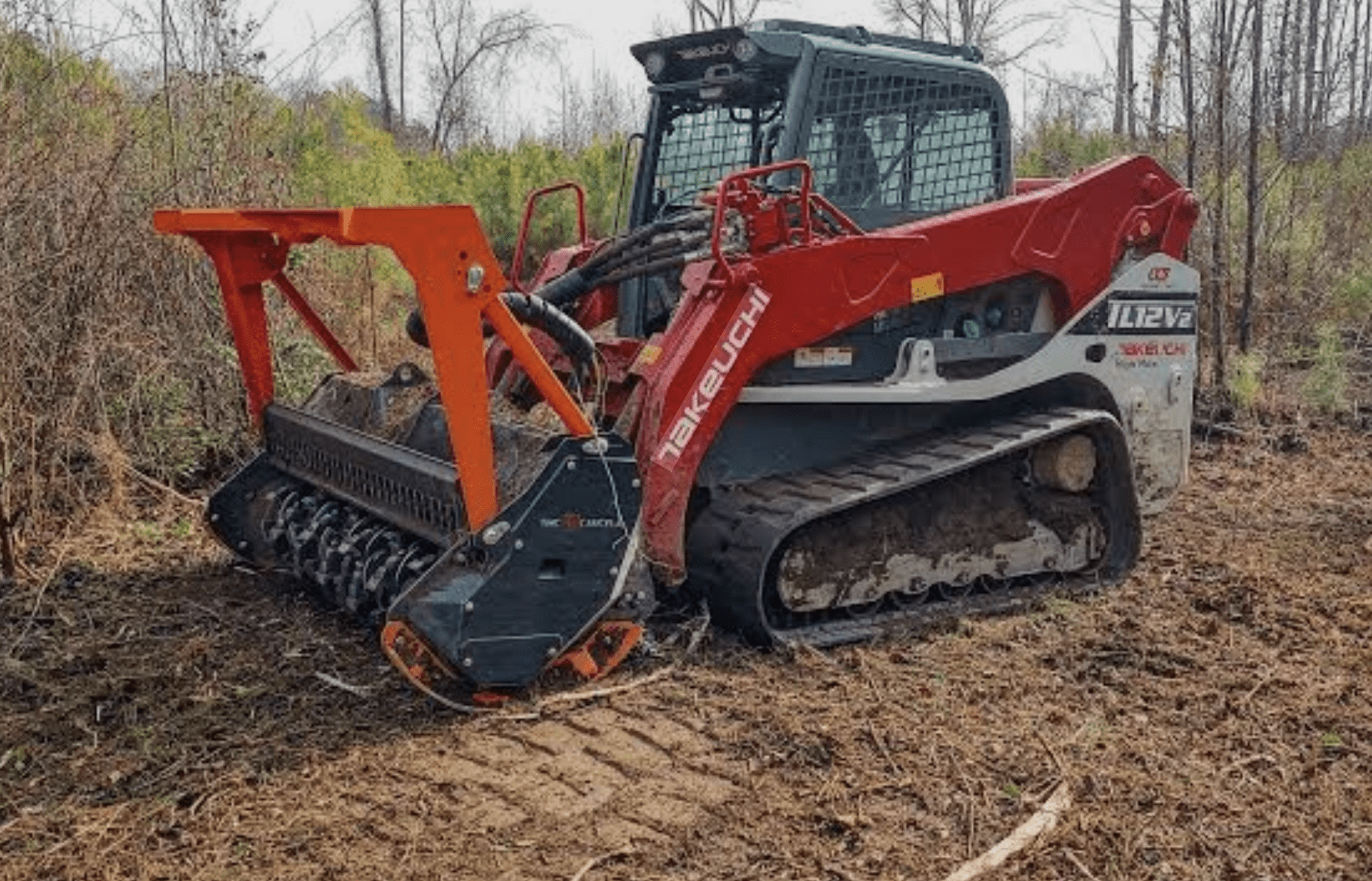 Skid steer back grading a cleared property