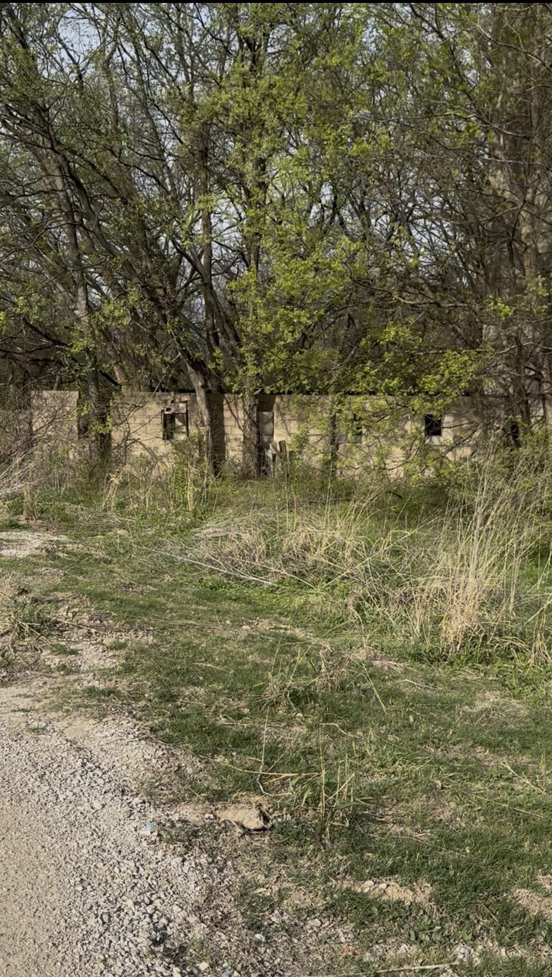 Before — cinder block shed structure on City of Glenpool property prior to demolition
